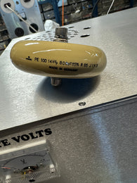 Plate blocking capacitor